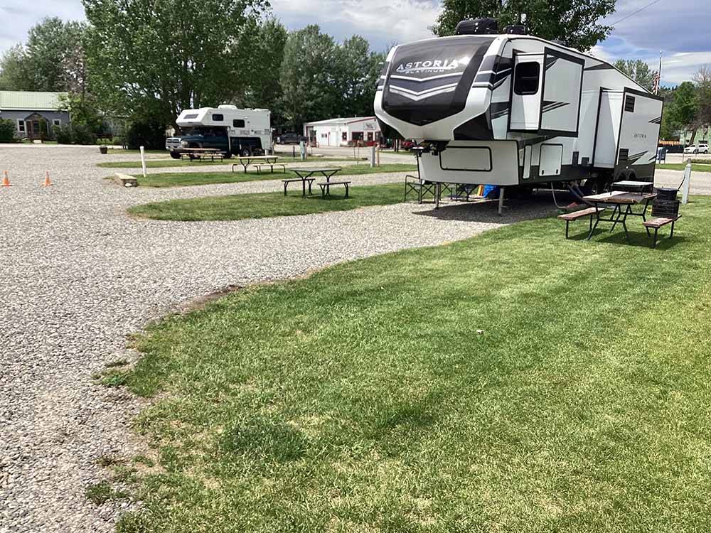 A fifth wheel trailer in a RV site at OLD WEST RV PARK