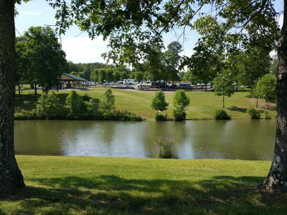 Trees near the water at MOUNTAIN GLEN RV PARK & CAMPGROUND