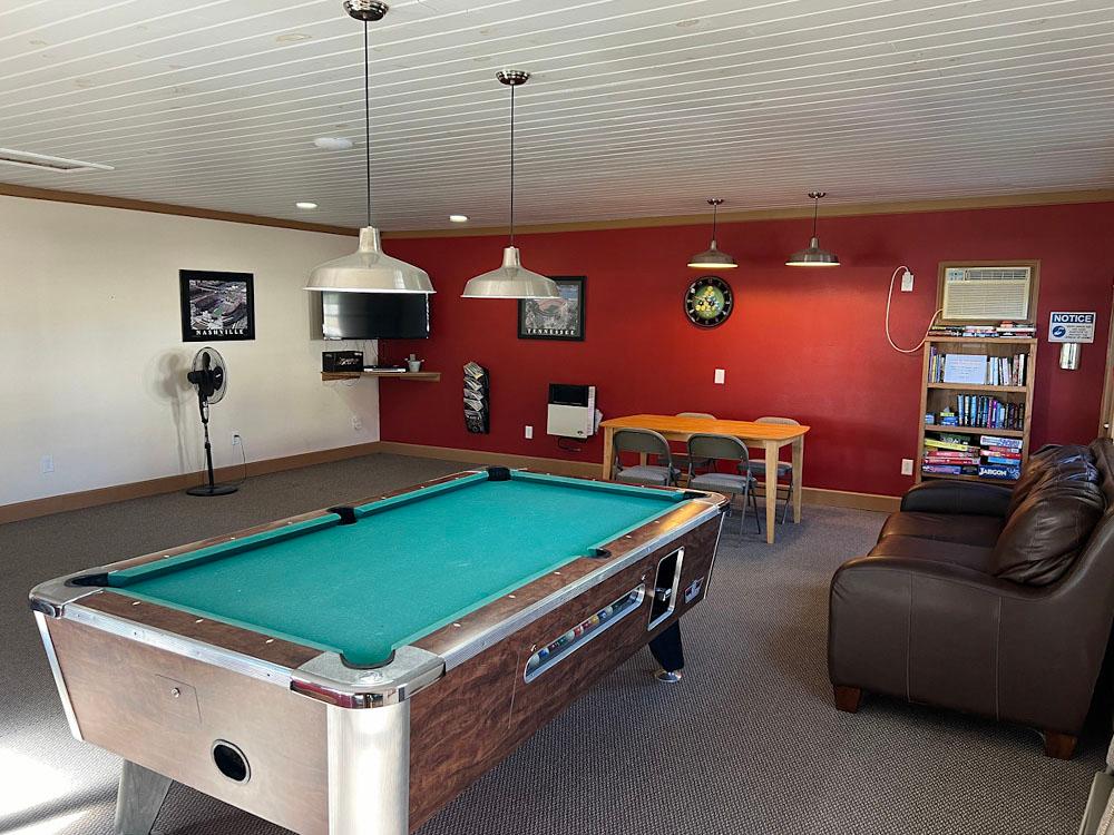 Pool table and sitting area at MOUNTAIN GLEN RV PARK & CAMPGROUND