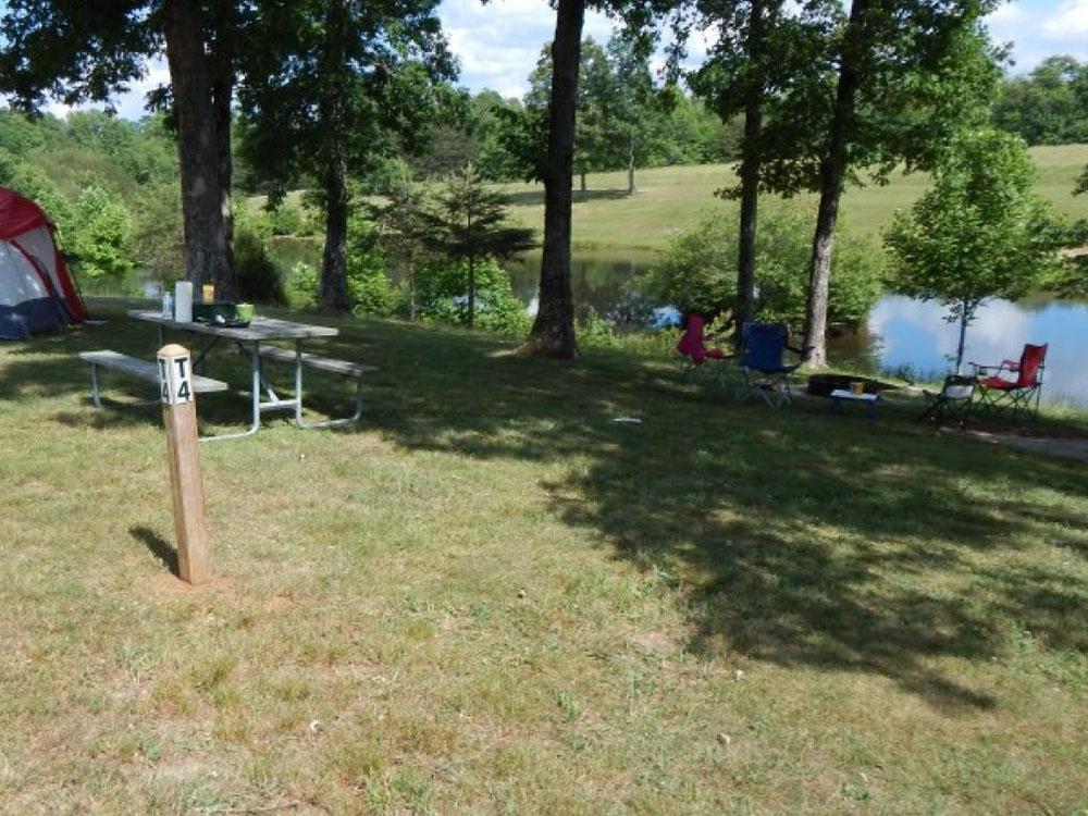 A tent under shade tree at MOUNTAIN GLEN RV PARK & CAMPGROUND