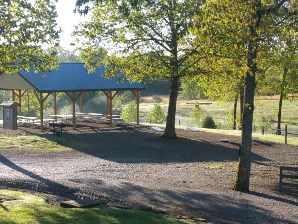 Gathering area with corn hole at MOUNTAIN GLEN RV PARK & CAMPGROUND