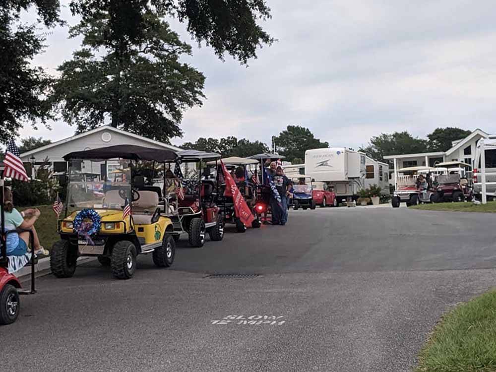 A row of decorated golf carts at BRIARCLIFFE RV RESORT