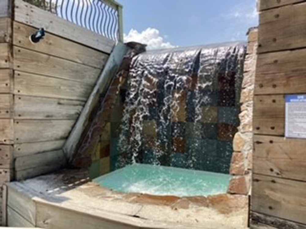 A waterfall coming down from the pool at NEW ORLEANS RESORT AND MARINA