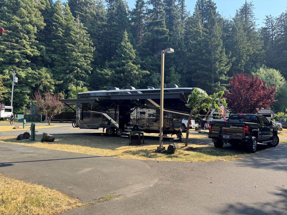 A travel trailer parked at site