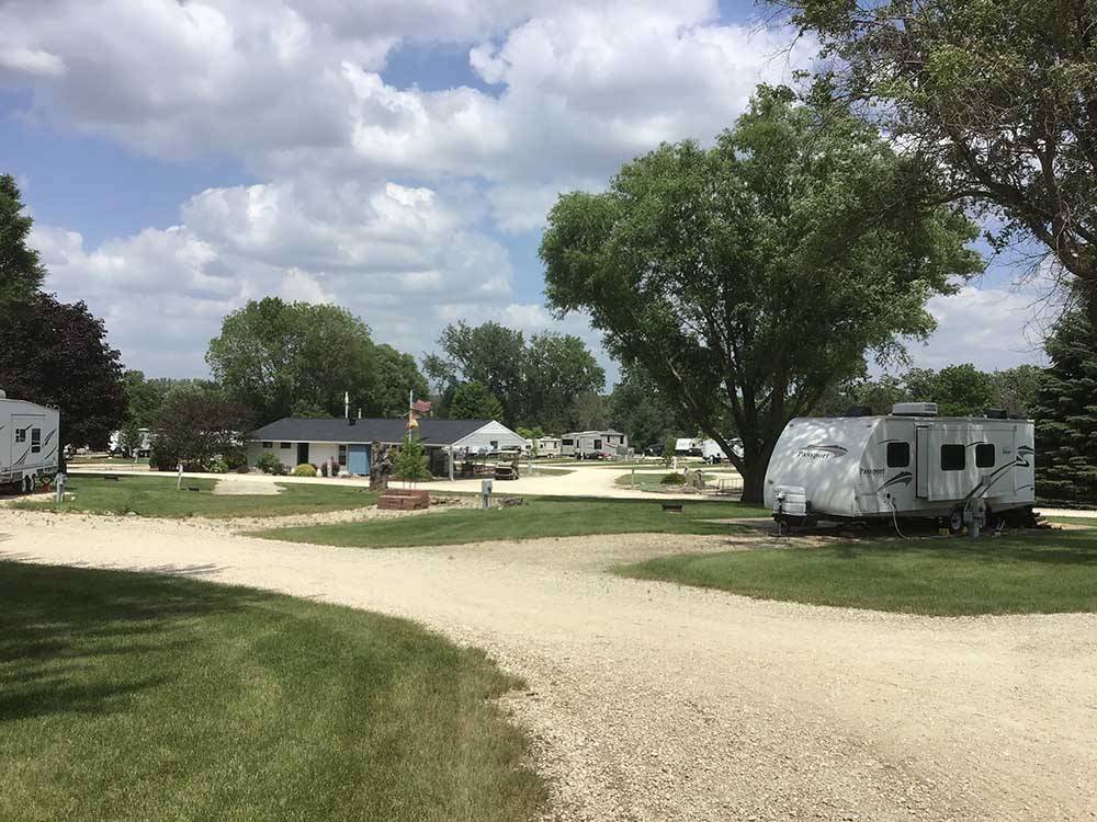 A gravel road between RV sites at LAKESHORE RV RESORT & CAMPGROUND