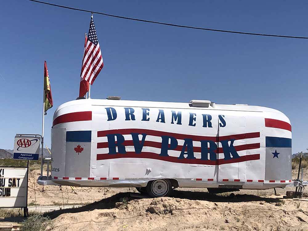 An Airstream with the parks name on it at 3 DREAMERS RV PARK