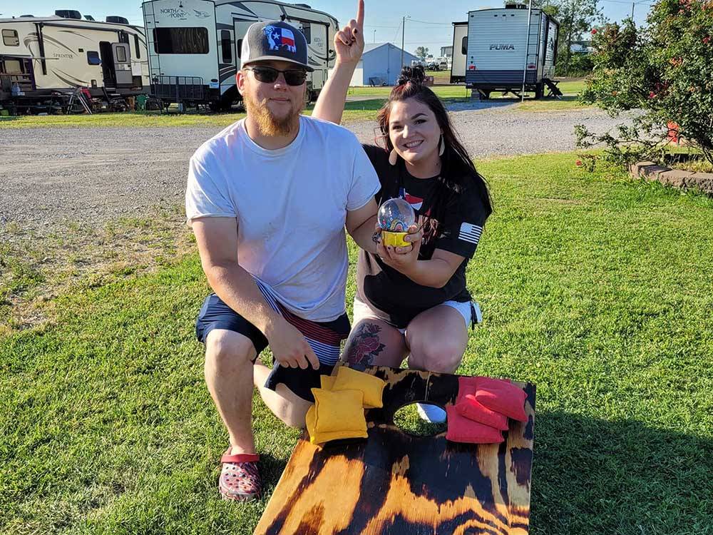Couple ready to play Cornhole at COYOTE VIEW RV PARK & RV REPAIR