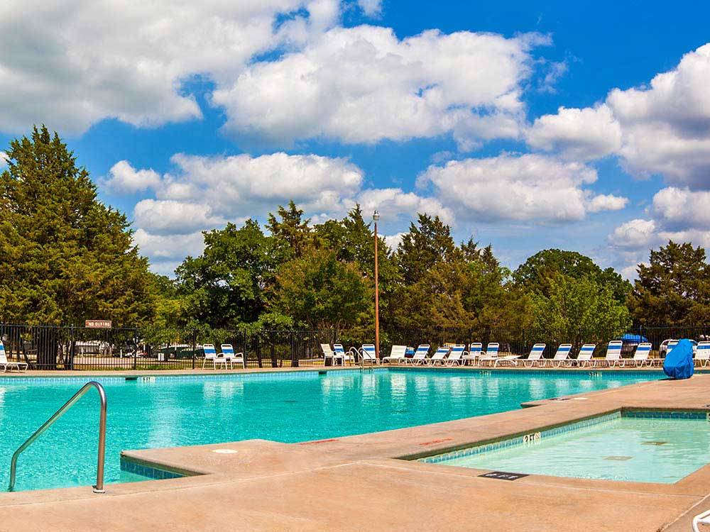 Swimming pool with outdoor seating at THOUSAND TRAILS LAKE TEXOMA