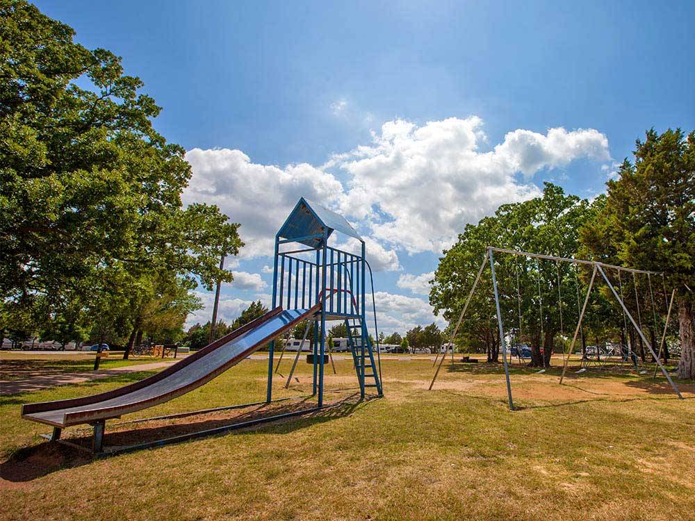 Playground with swing set at THOUSAND TRAILS LAKE TEXOMA