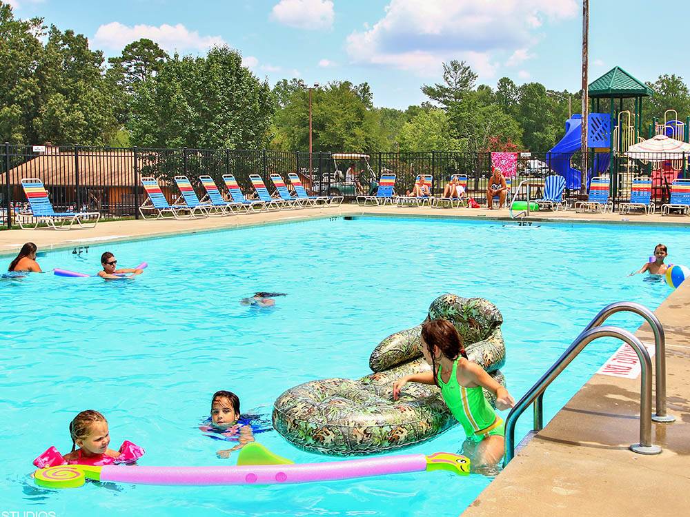Kids swimming in pool at THOUSAND TRAILS FOREST LAKE