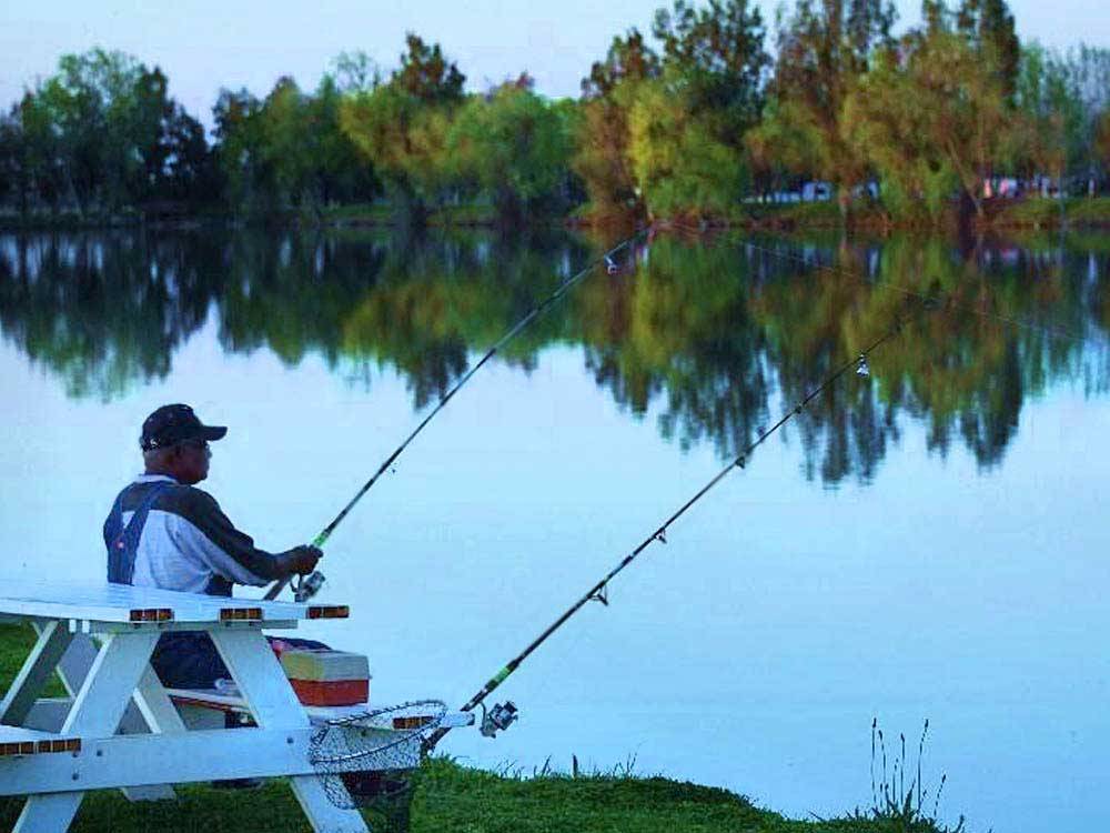 Man fishing at THOUSAND TRAILS LAKE MINDEN