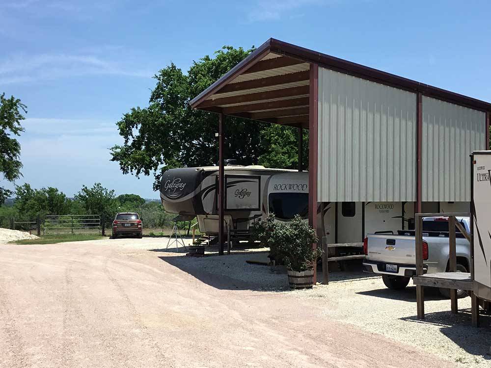 The metal pavilion covering a trailer at EAST VIEW RV RANCH