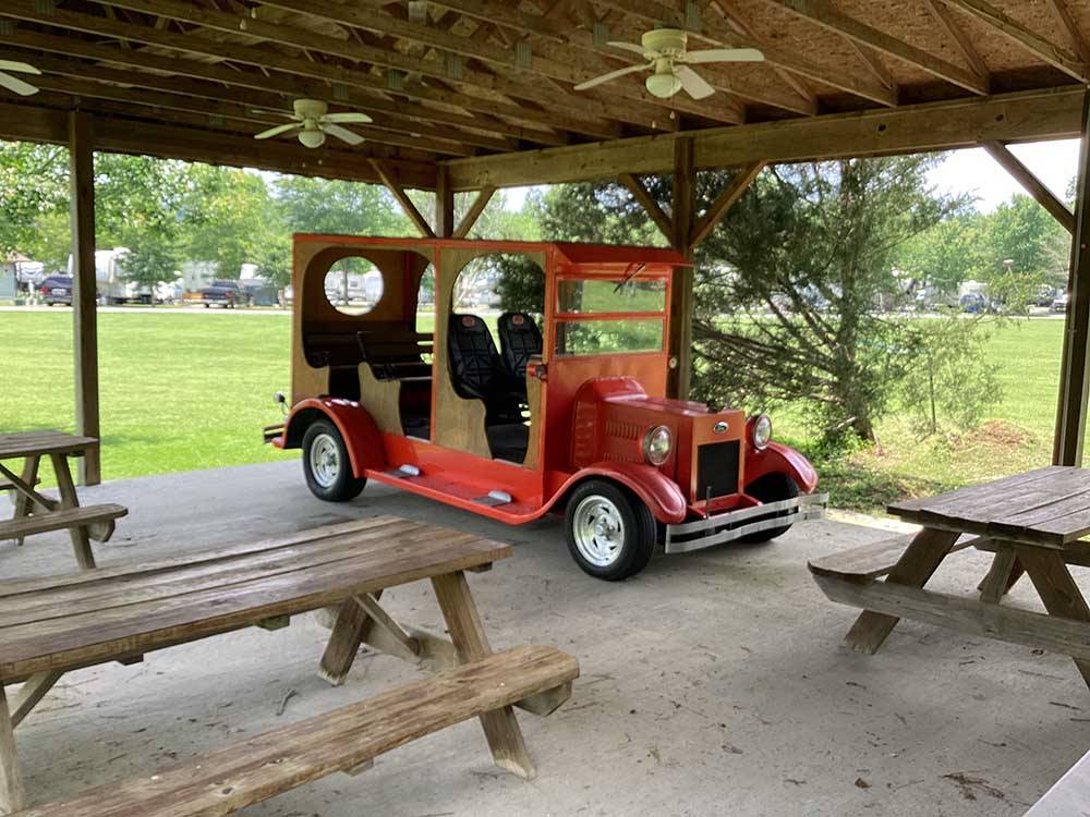 A red truck model under the pavilion at WILLS CREEK RV PARK
