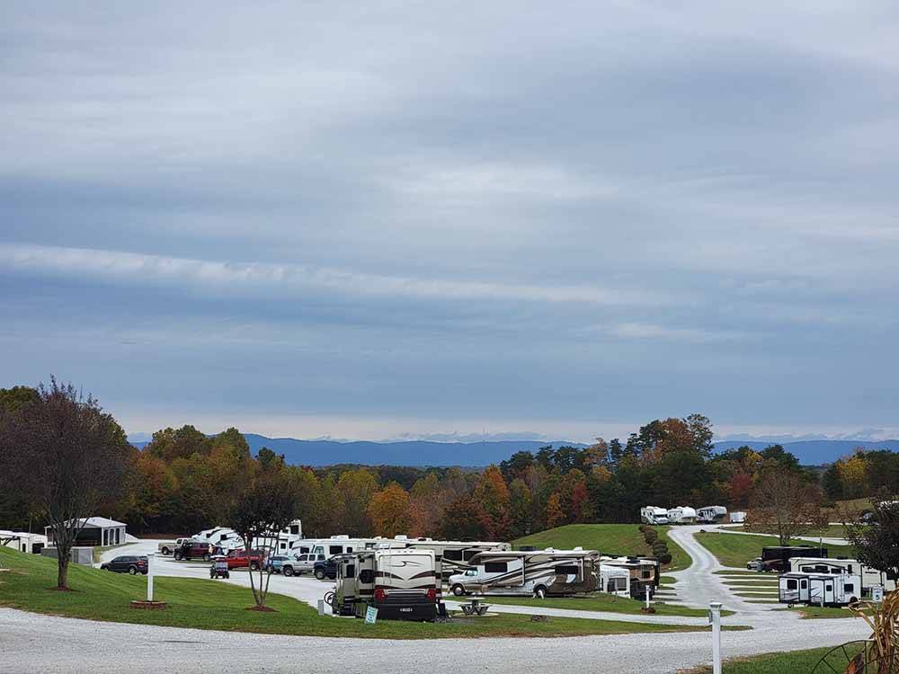 Rows of trailers and motorhomes in gravel sites at MAYBERRY CAMPGROUND