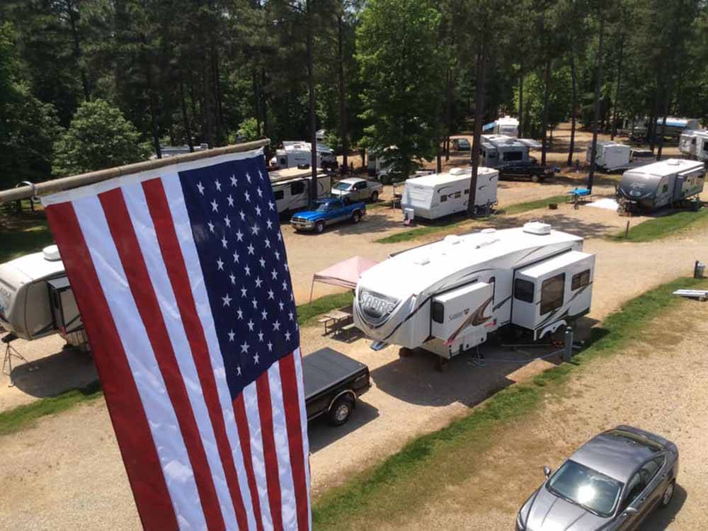 An aerial view of the campsites with an American flag at CROSS WINDS FAMILY CAMPGROUND