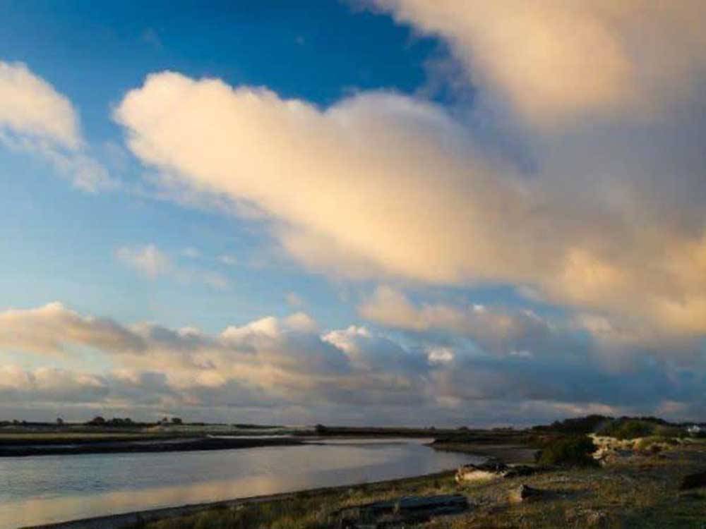 White clouds over a shoreline nearby at SHORELINE RV PARK
