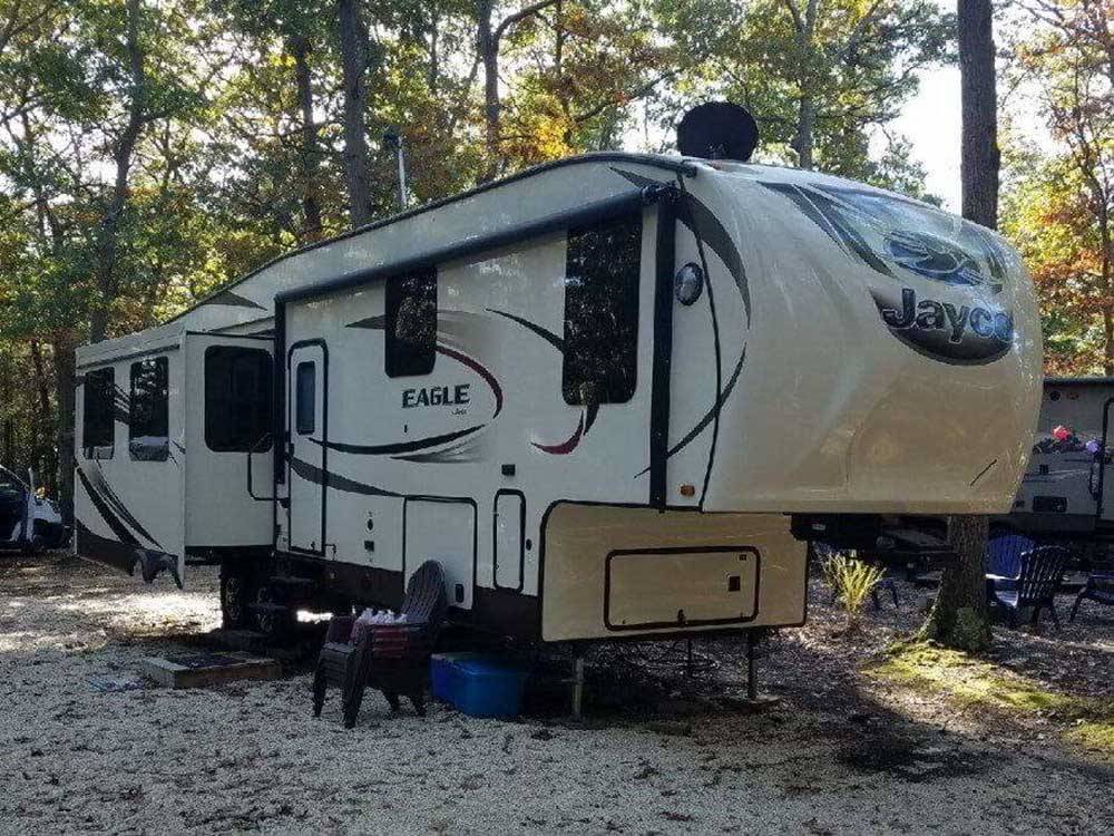 A fifth wheel parked at a deluxe site at ATLANTIC BLUEBERRY RV PARK