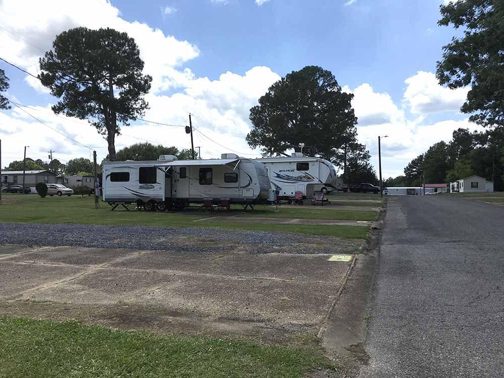 Two trailers parked in RV sites at THE PINES MH AND RV COMMUNITY