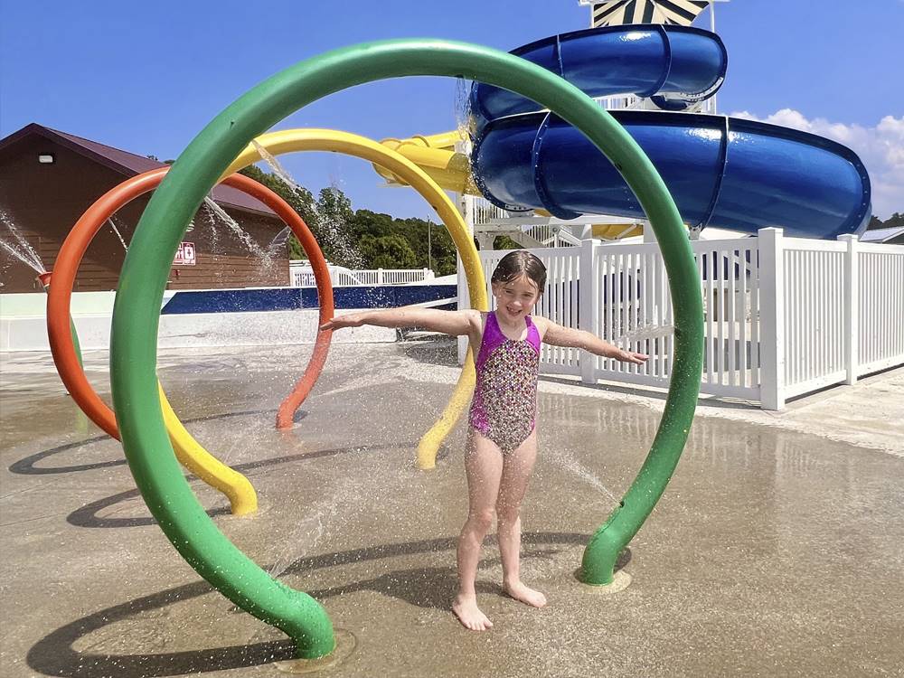 A young girl enjoying the splash park at YOGI BEAR'S JELLYSTONE PARK AT DELAWARE BEACH