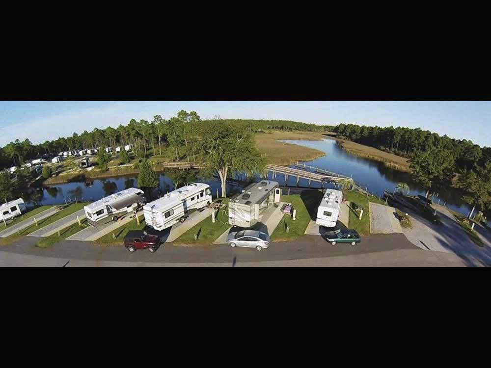 Paved back in RV sites by the water at AVALON LANDING RV PARK