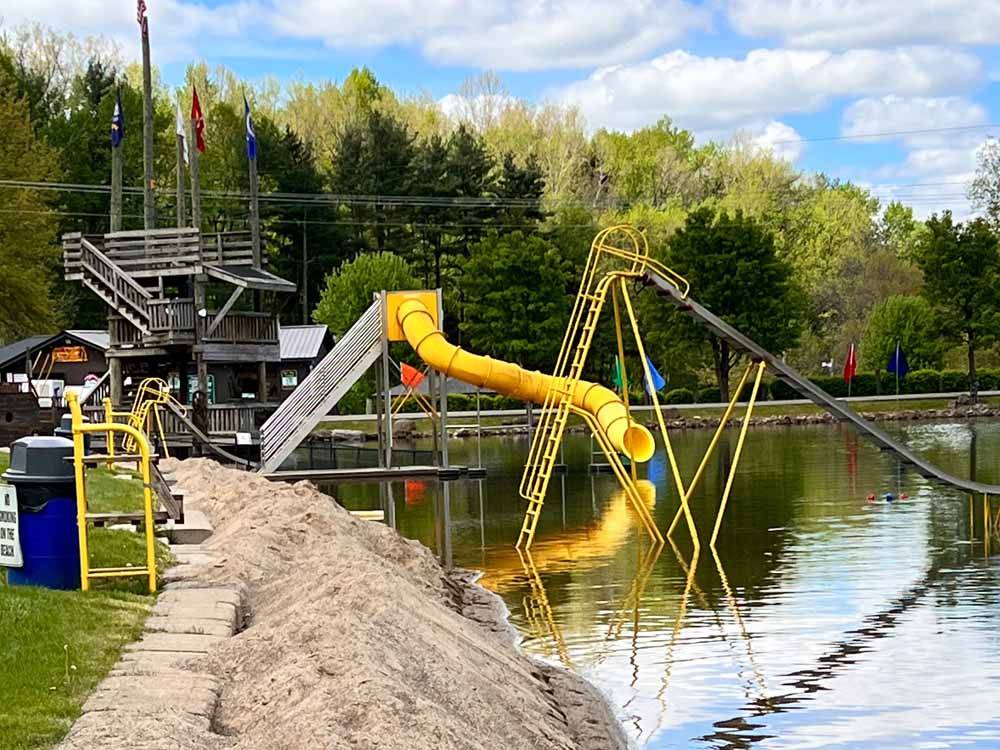 The playground equipment on the water at WOOD'S TALL TIMBER RESORT