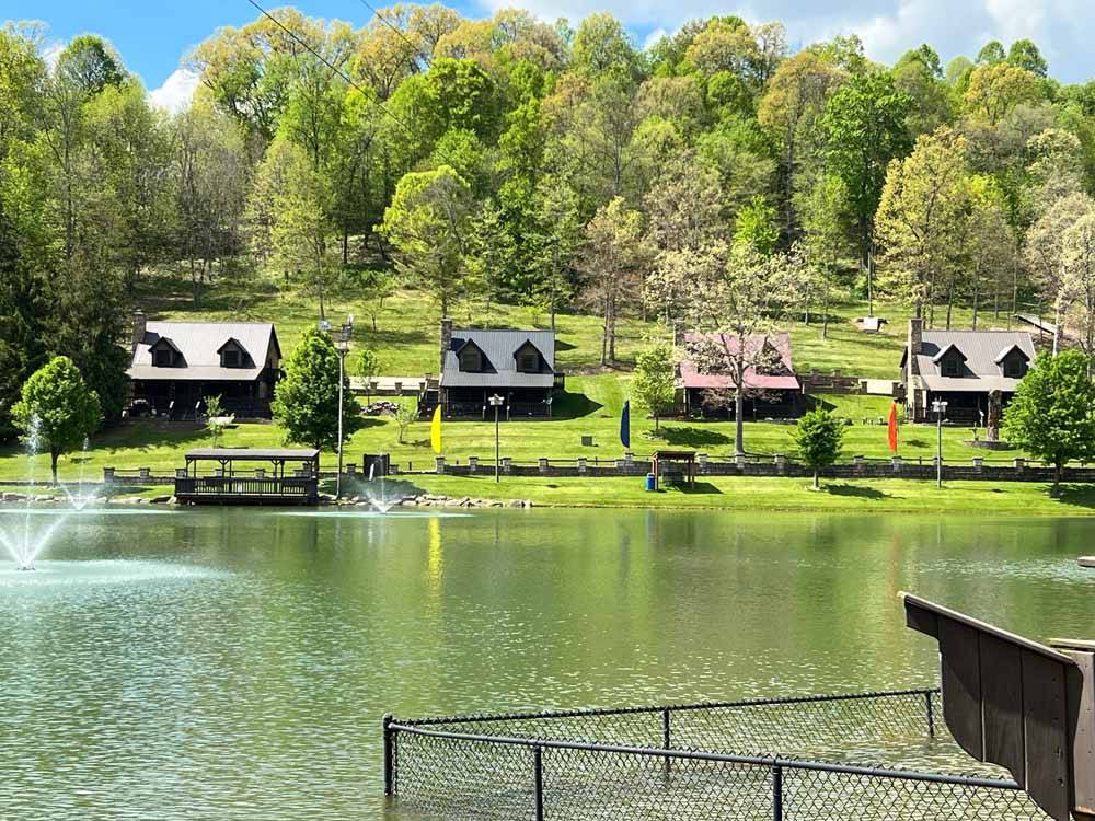 A row of rental cottages on the water at WOOD'S TALL TIMBER RESORT