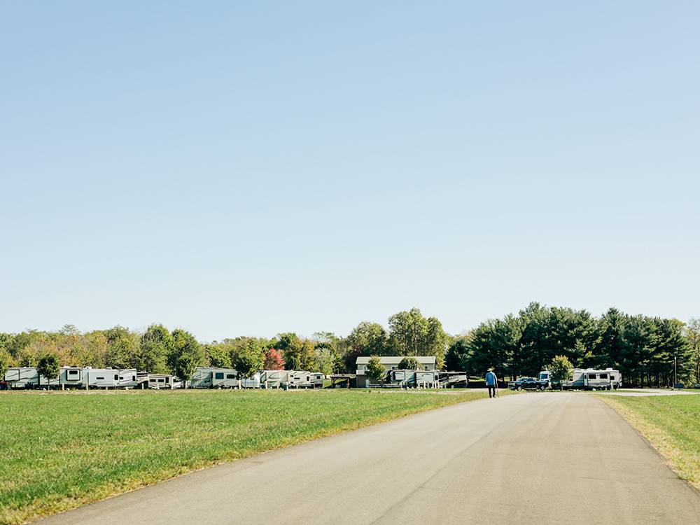 Man walking on a park road at Timbercrest Camp and RV Park