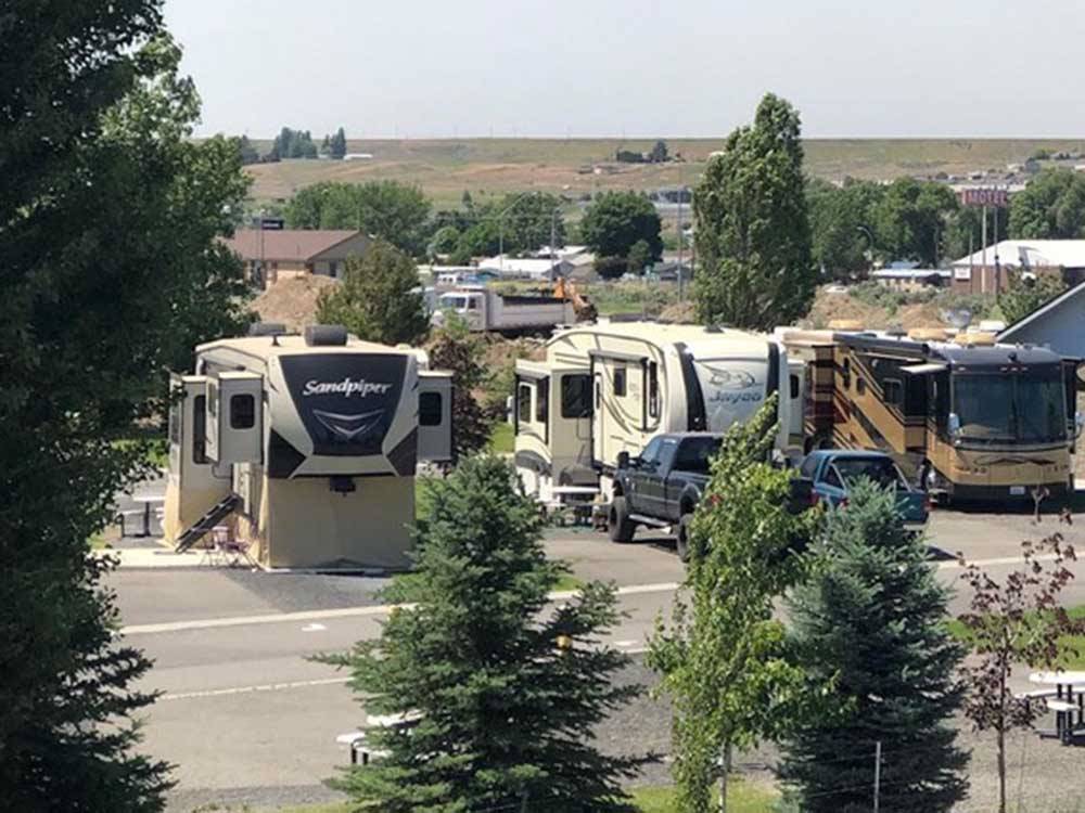 Rows of RVs camping in spaces at COYOTE RUN RV PARK