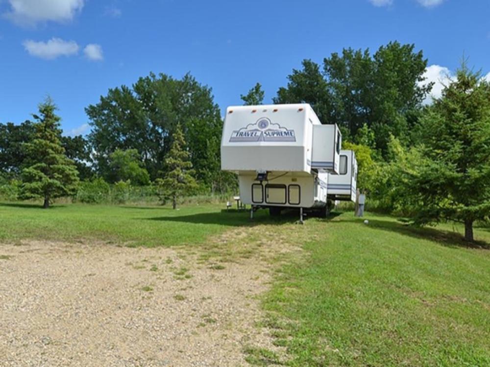 Trailer in grassy RV site at RV There Yet?