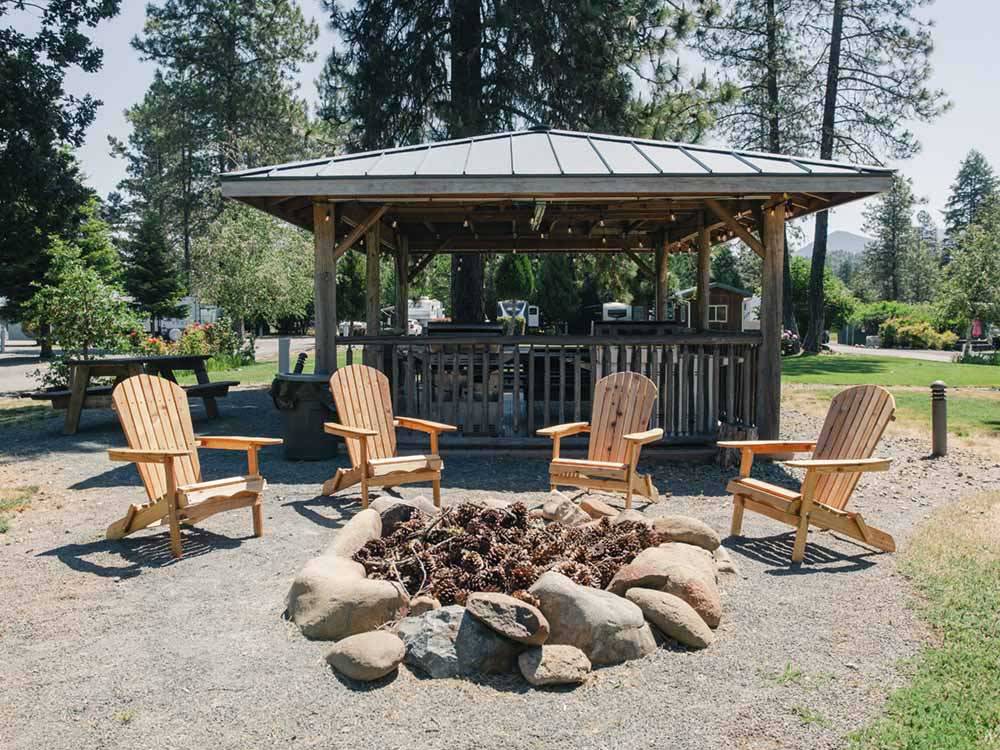 Chairs and a fire pit near a bbq area at LONE MOUNTAIN RESORT