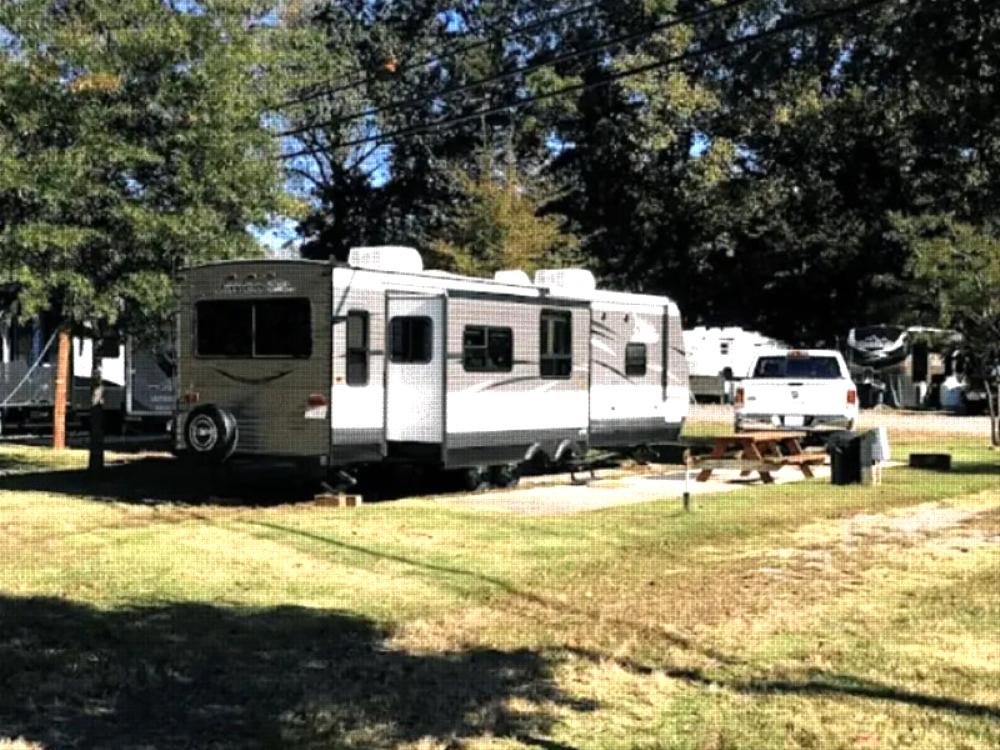 Parked RV with panic area at site Indian Heritage RV Park