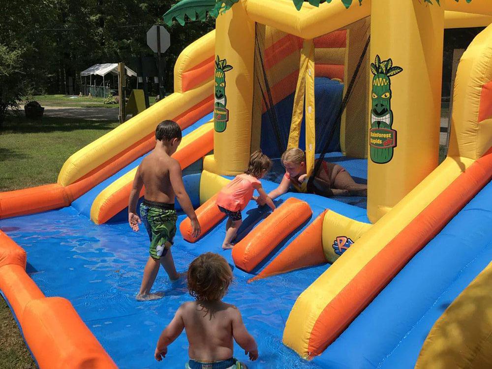 Kids playing in the water slide at WHITE PINES CAMPSITES