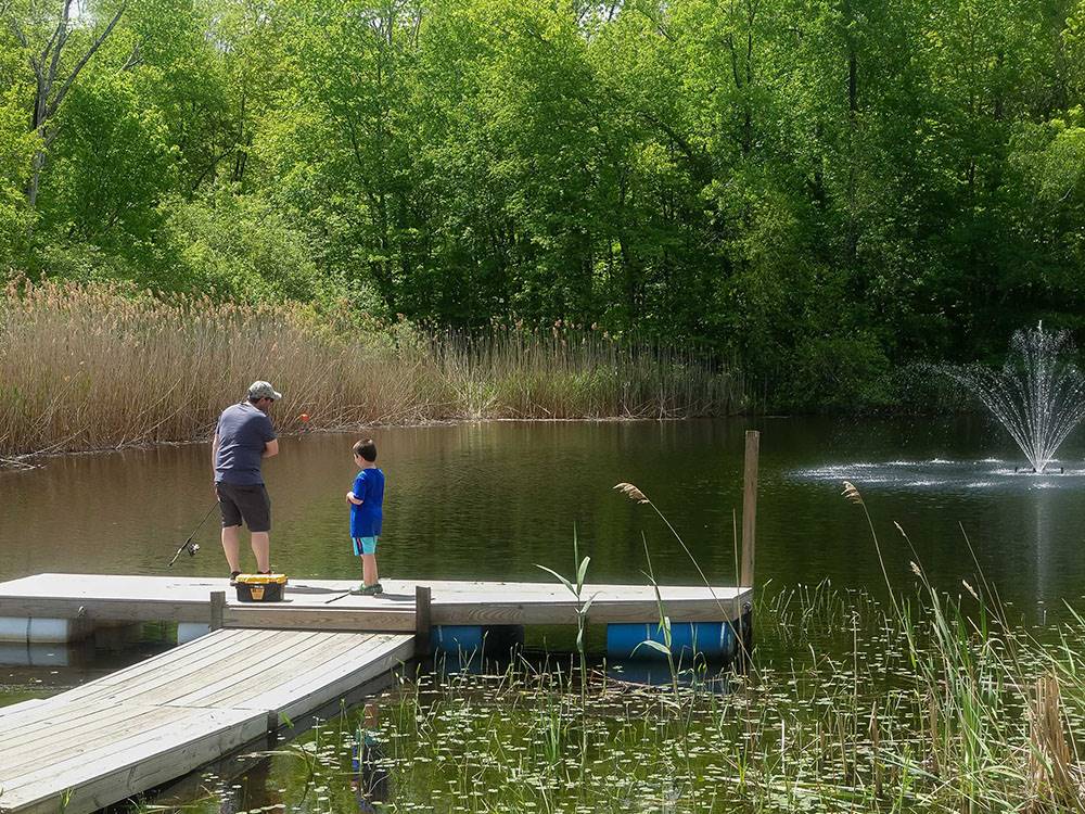Kid and father fishing