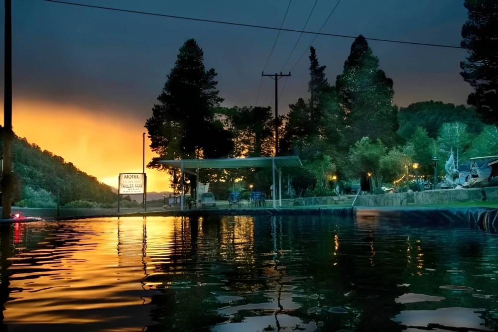 View of water and park at sunset