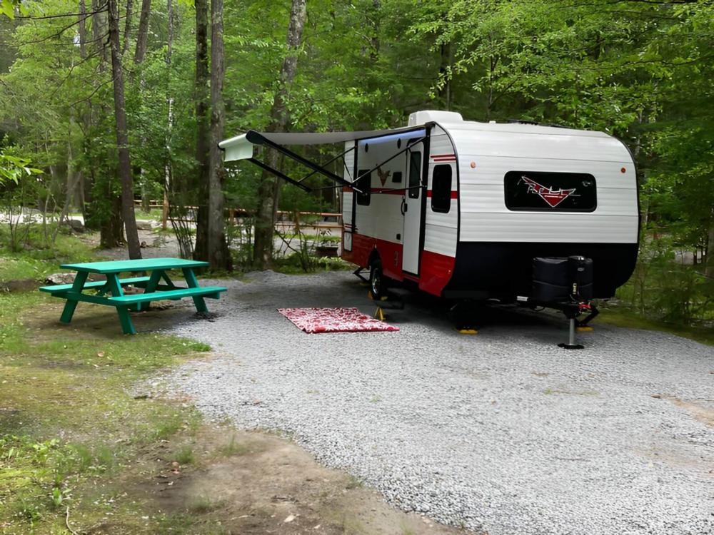 Trailer and green picnic table