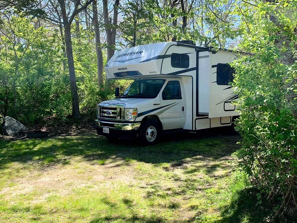 A motorhome in a private RV site at SHADY KNOLL CAMPGROUND