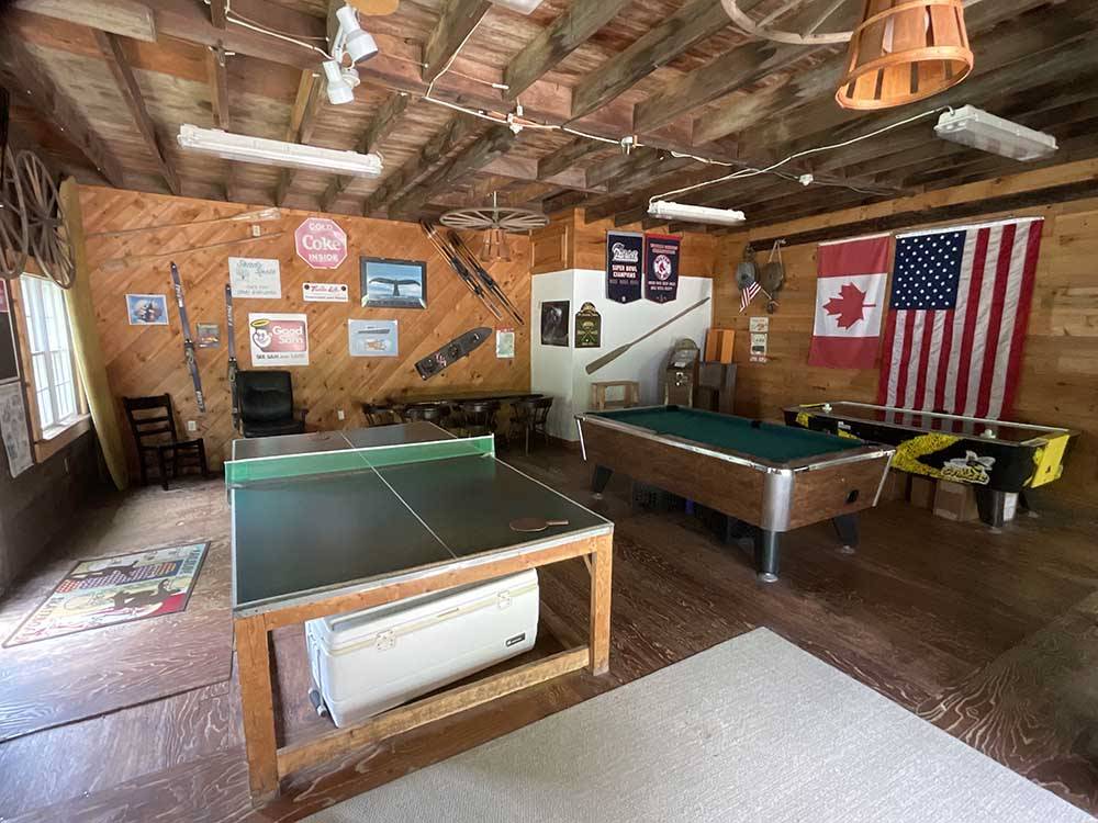A pool and ping pong table at SHADY KNOLL CAMPGROUND