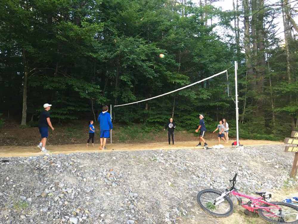 People playing beach volleyball at CLEARWATER CAMPGROUND