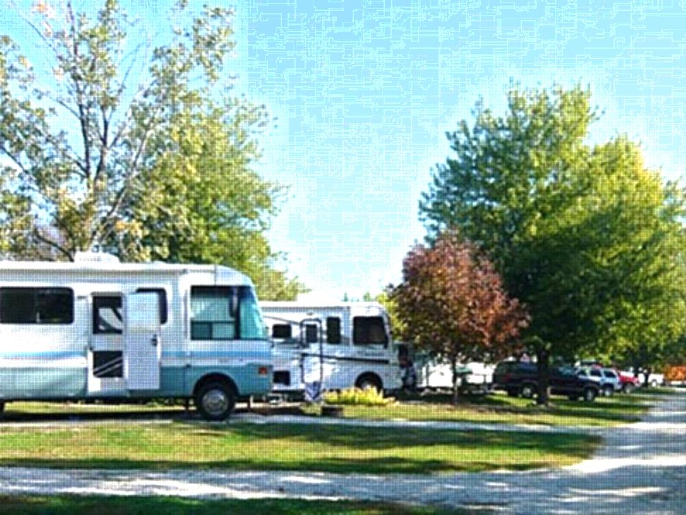 Parked RV's at site Yogi Bear's Jellystone Park at Pine Lakes