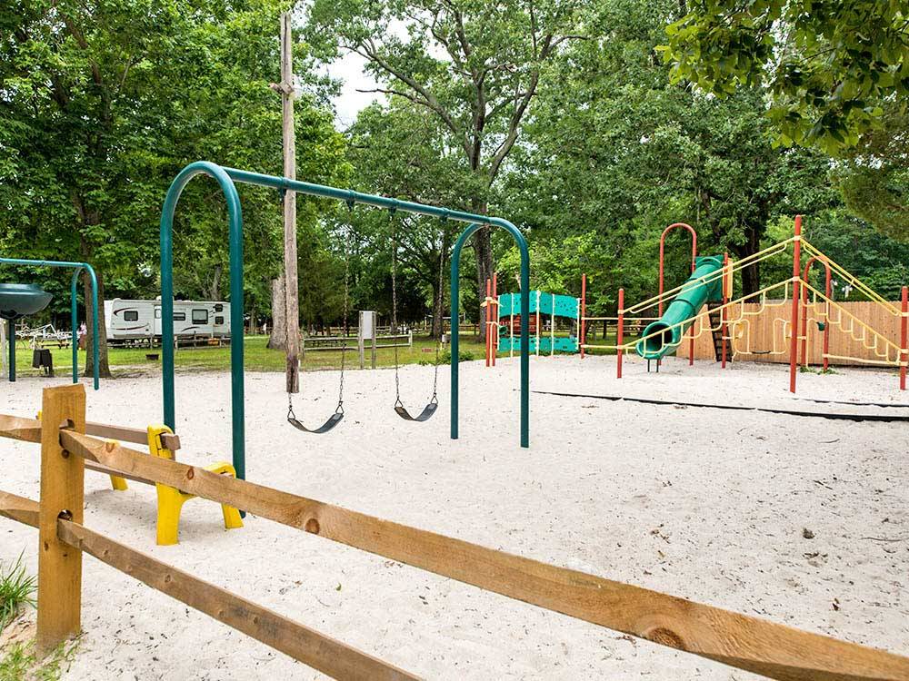 Playground with swing set at MAYS LANDING RESORT