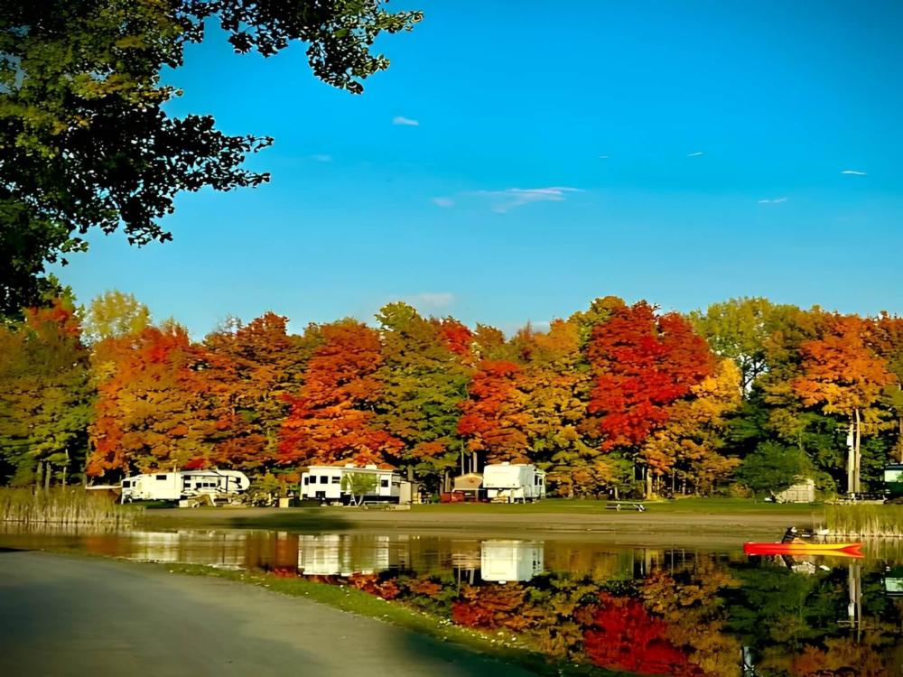 Parked trailer with fall trees at Sleepy Hollow Lake