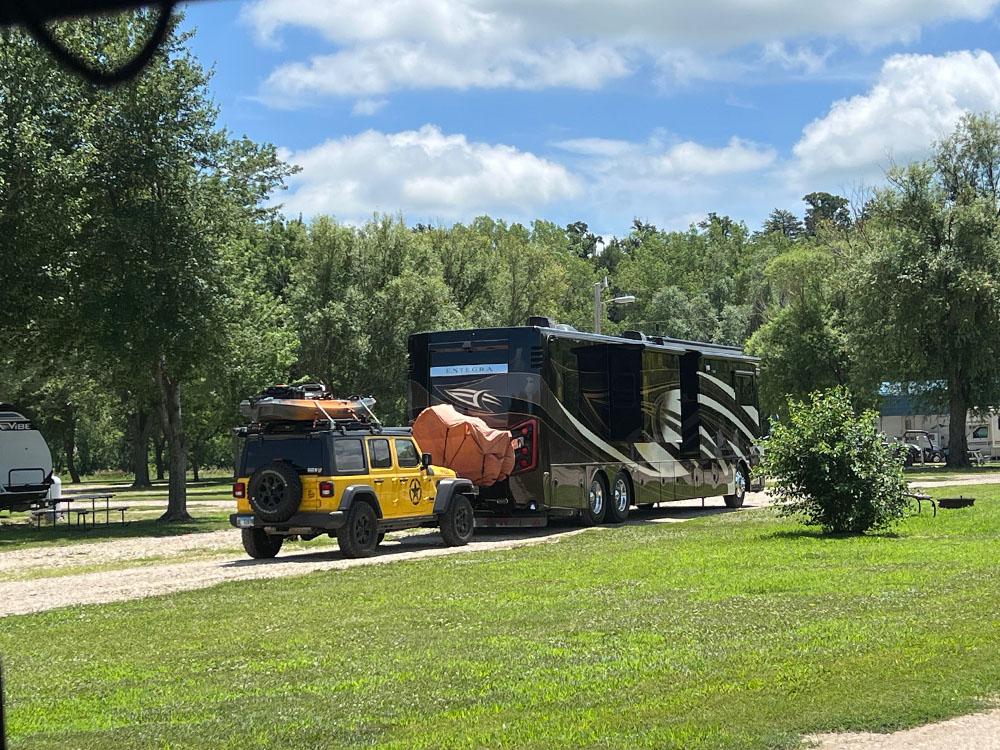 A motorhome towing a Jeep