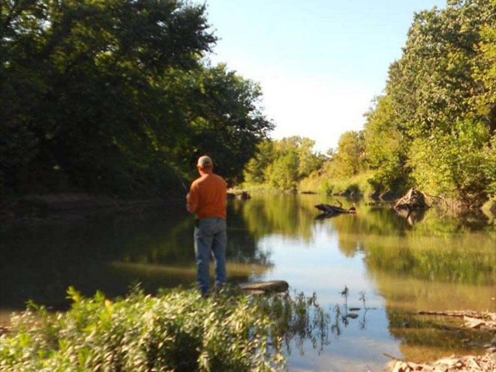 A man fishing in Mill Creek