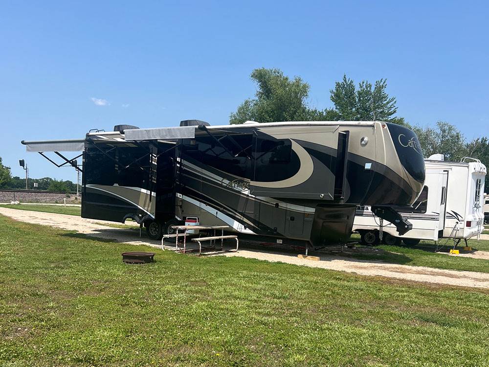 A fifth-wheel trailer parked at site