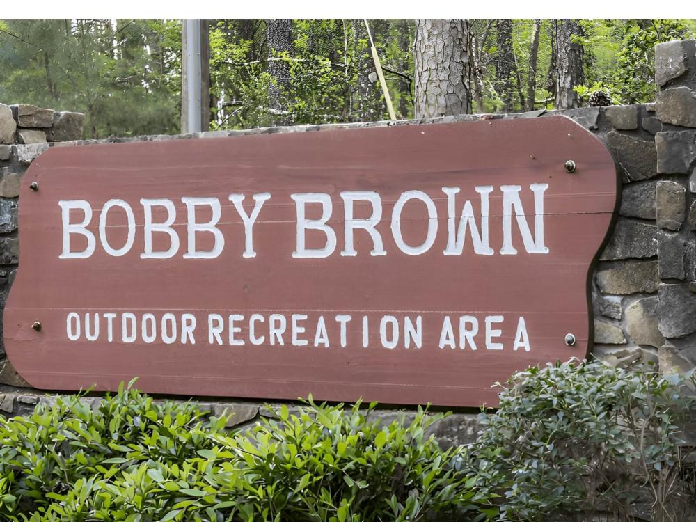 Welcome sign at site Bobby Brown