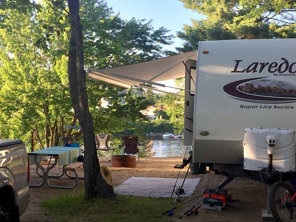 One of the campsites by the water at SID TURCOTTE PARK CAMPING AND COTTAGE RESORT