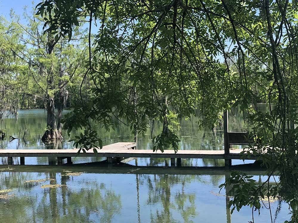 An empty dock awaits you at FLORIDA CAVERNS RV RESORT AT MERRITT'S MILL POND