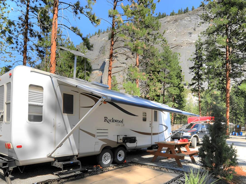 RV in a site with picnic table