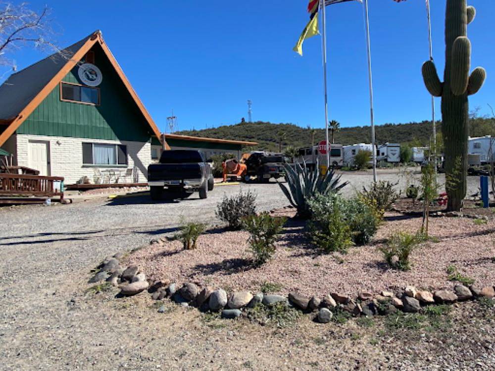 Cactus in front of an A-Frame building at Black Canyon Campground