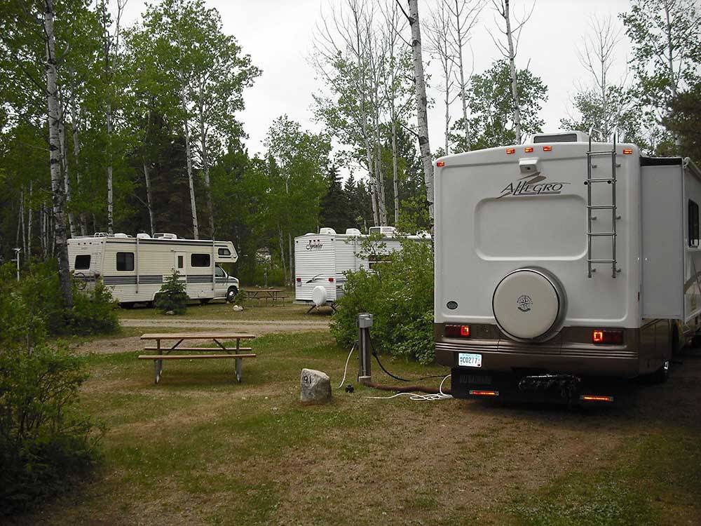 A group of gravel RV sites at HAPPY LAND RV PARK